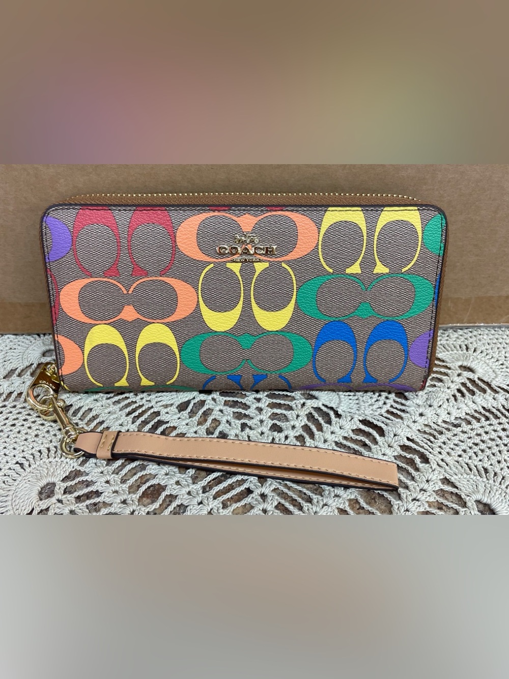 Coach long zip-around wallet featuring a vibrant rainbow 🌈